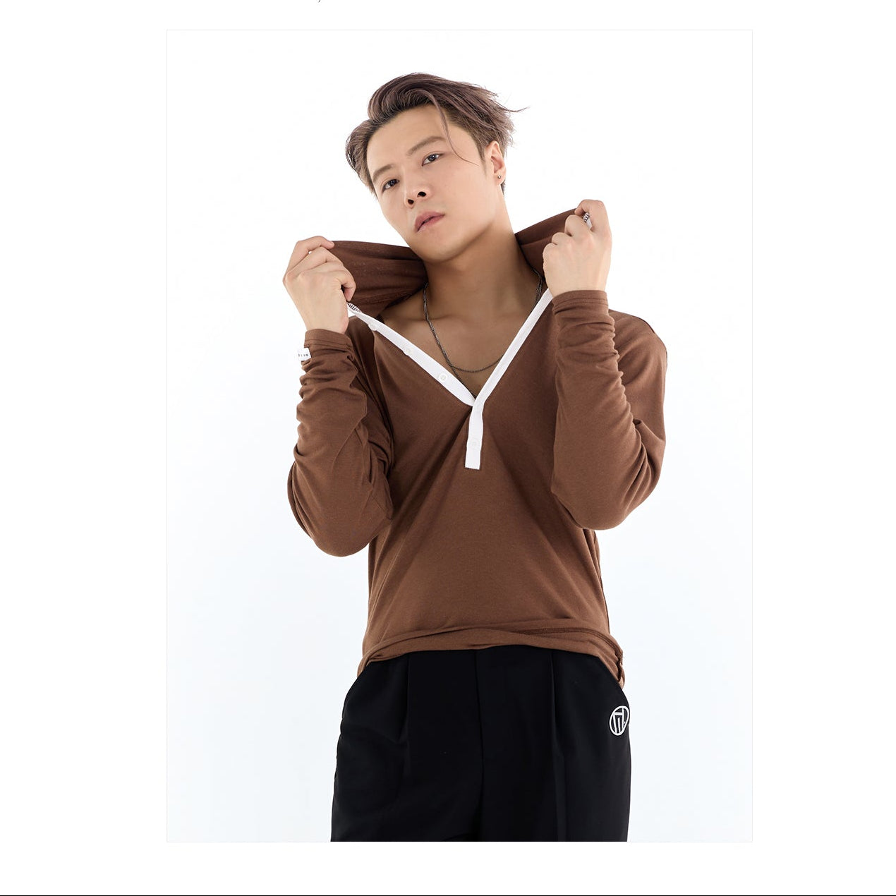 Person wearing a brown hoodie with a white zipper, standing against a white background with 'DUYQ odesign' branding.
