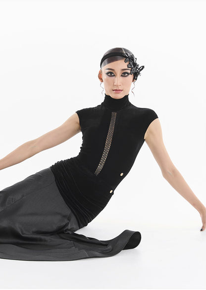 Woman wearing a black dress with a white background, featuring a brand logo.