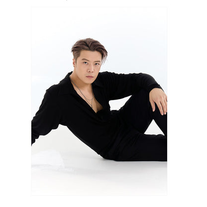 Person wearing a black outfit with a white triangle design on a white background, featuring the brand 'DYQ DESIGN'.