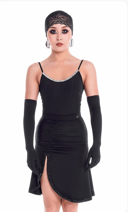 Woman wearing a black dress with long gloves on a white background
