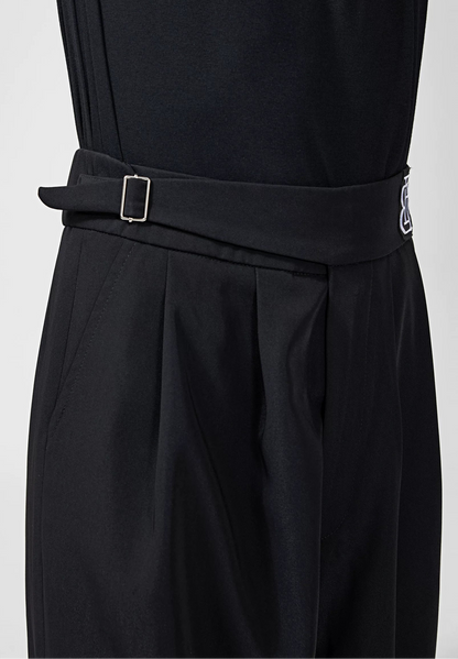 Close-up of a black dance outfit with a matching waist belt and silver buckle, shown on a model against a light gray background. The BOBO DANCE brand logo is visible in the top left corner.