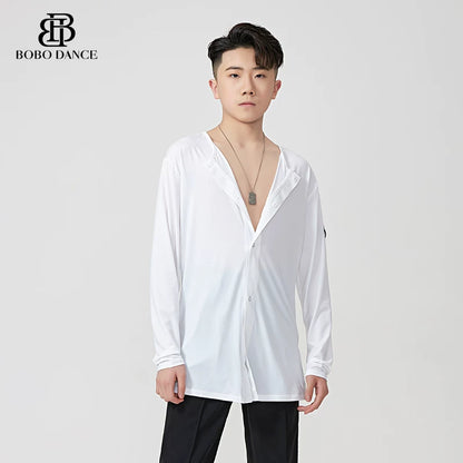 A male model wearing a white long-sleeve button-up shirt with a split V-neck collar, styled with black pants against a light gray studio background. The BOBO DANCE brand logo is visible in the top left corner.