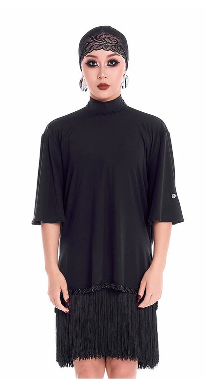 Person wearing a black dress with a matching headscarf on a white background